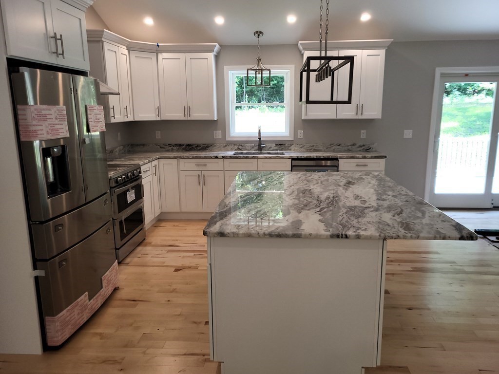 17 Harwood Farm Road Southbridge, MA 01550 - Photo 4 of 23 a kitchen with stainless steel appliances granite countertop a refrigerator a stove and a sink