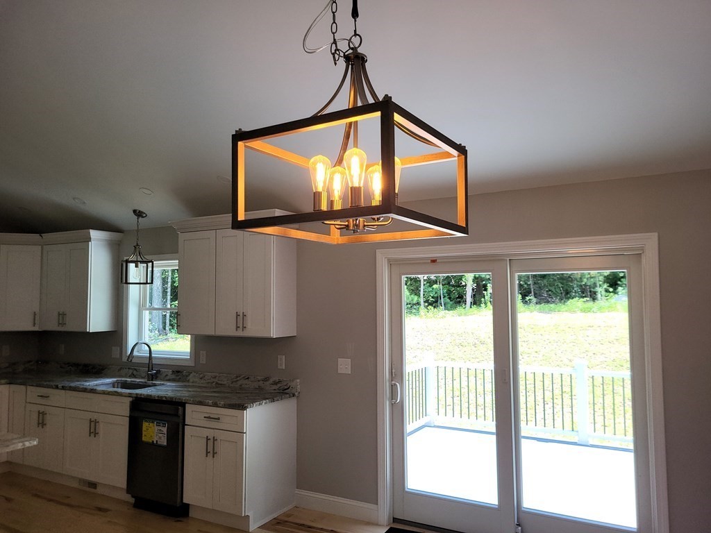 17 Harwood Farm Road Southbridge, MA 01550 - Photo 5 of 23 a kitchen with stainless steel appliances granite countertop a stove a sink and a window