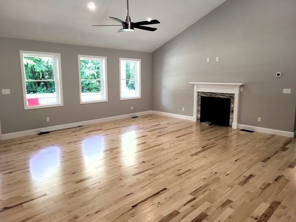 17 Harwood Farm Road Southbridge, MA 01550 - Photo 9 of 23 an empty room with wooden floor chandelier and windows