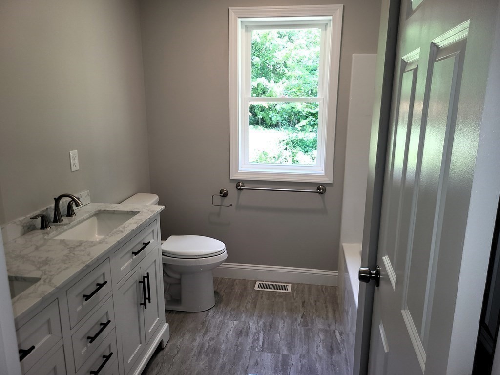 17 Harwood Farm Road Southbridge, MA 01550 - Photo 10 of 23 a bathroom with a granite countertop sink toilet and shower