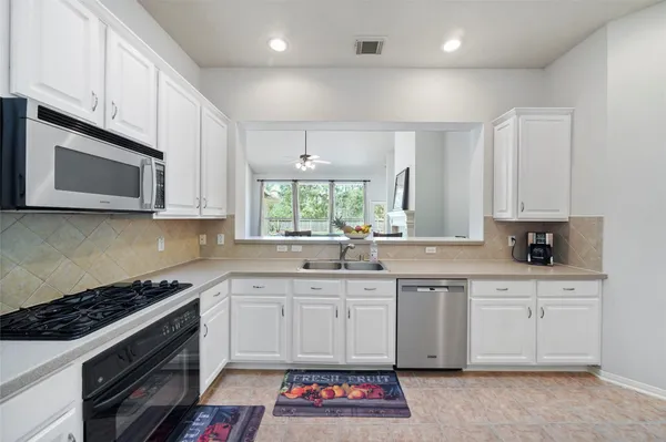 a utility room with closet dryer and washer