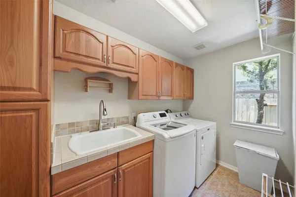 a bathroom with a sink vanity and mirror