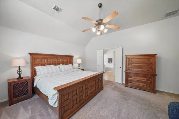 a bedroom with furniture and a bed