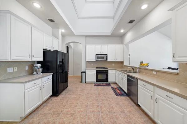 a living room with furniture fireplace and a large window
