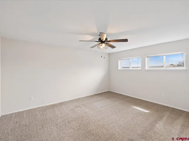 a view of a big room with windows