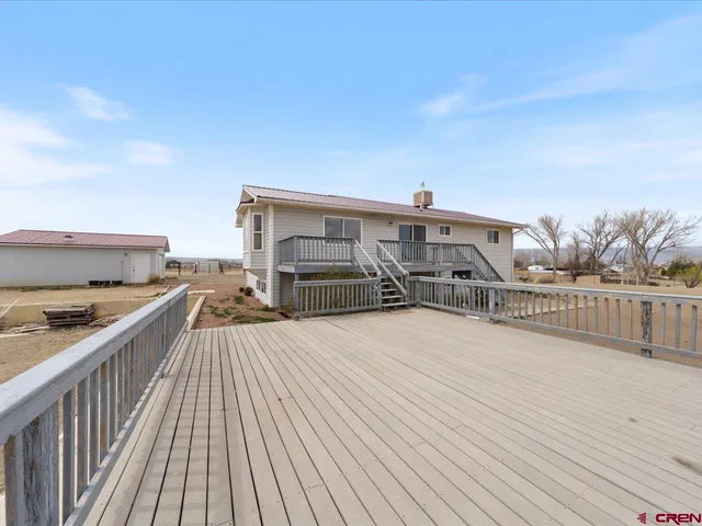 a view of a terrace with wooden floor and city view
