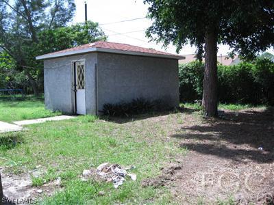 9065 Hamlin Road West Fort Myers, FL 33967 - Photo 5 of 5 a backyard of a house with lots of green space
