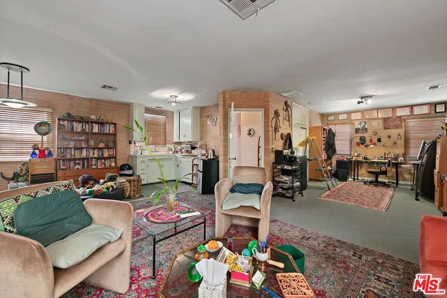 a kitchen with a refrigerator and a sink