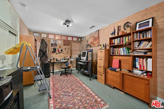 a room with furniture and a flat screen tv