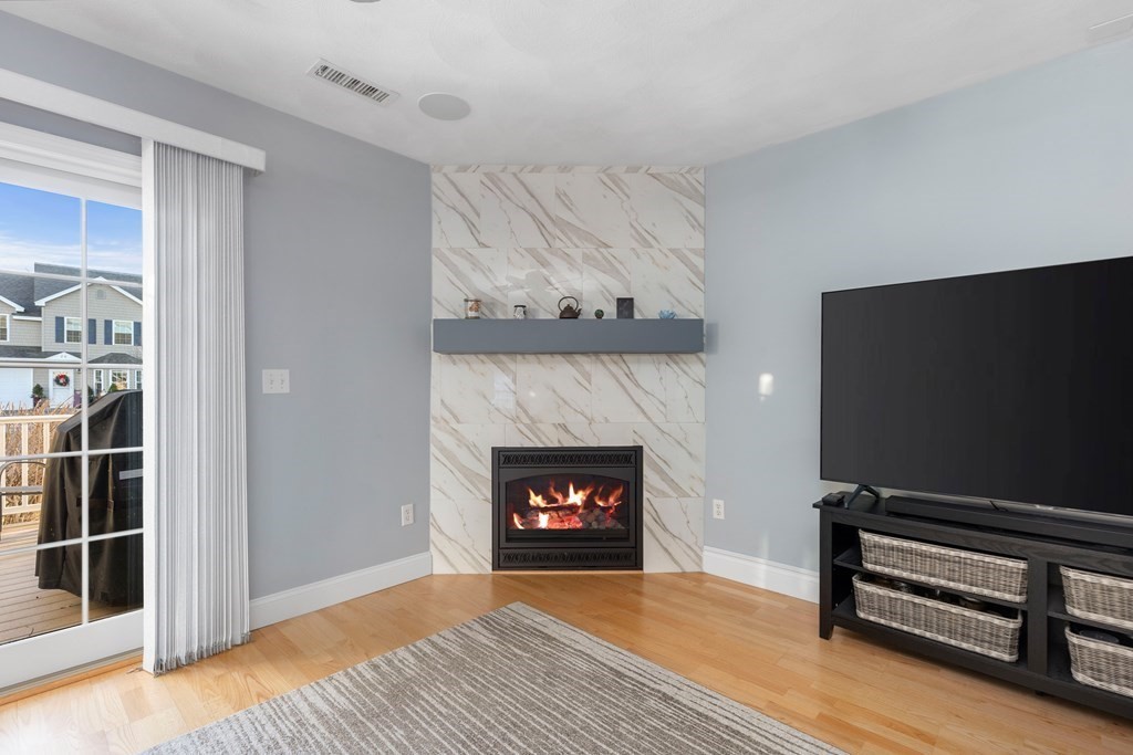 170 Beach Road, Unit 36 Salisbury, MA 01952 - Photo 13 of 40 a living room with furniture and a fireplace