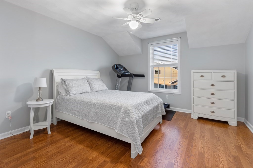170 Beach Road, Unit 36 Salisbury, MA 01952 - Photo 23 of 40 a bedroom with a bed and a flat tv screen on dresser