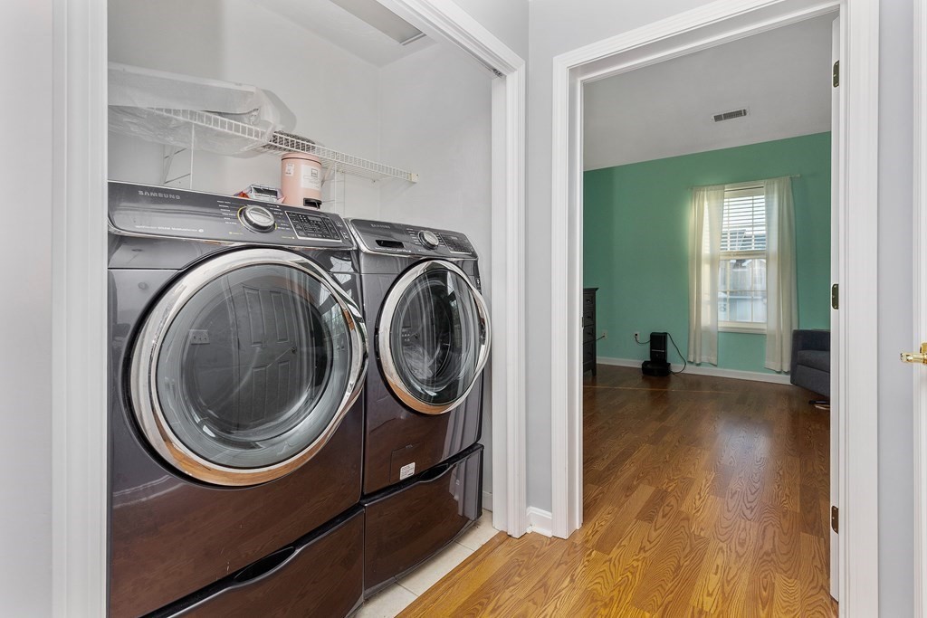 170 Beach Road, Unit 36 Salisbury, MA 01952 - Photo 26 of 40 a view of a storage & utility room with washer and dryer