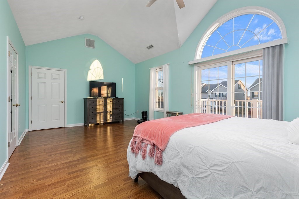 170 Beach Road, Unit 36 Salisbury, MA 01952 - Photo 28 of 40 a spacious bedroom with a bed and a large window