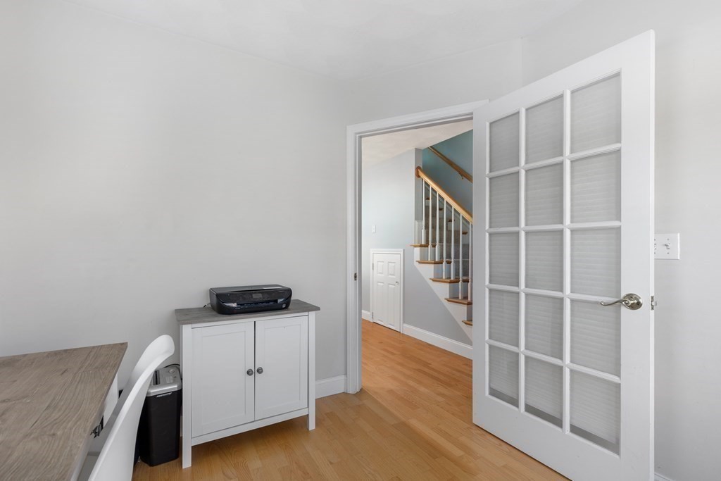 170 Beach Road, Unit 36 Salisbury, MA 01952 - Photo 8 of 40 a view of an empty room with wooden floor and a window