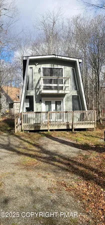 a view of house with car parked