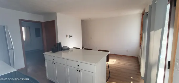 a room with a sink and a mirror