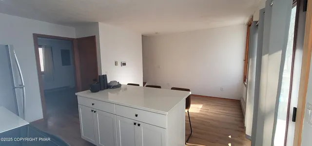 a room with a sink and a mirror