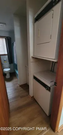 a kitchen with a refrigerator and a stove