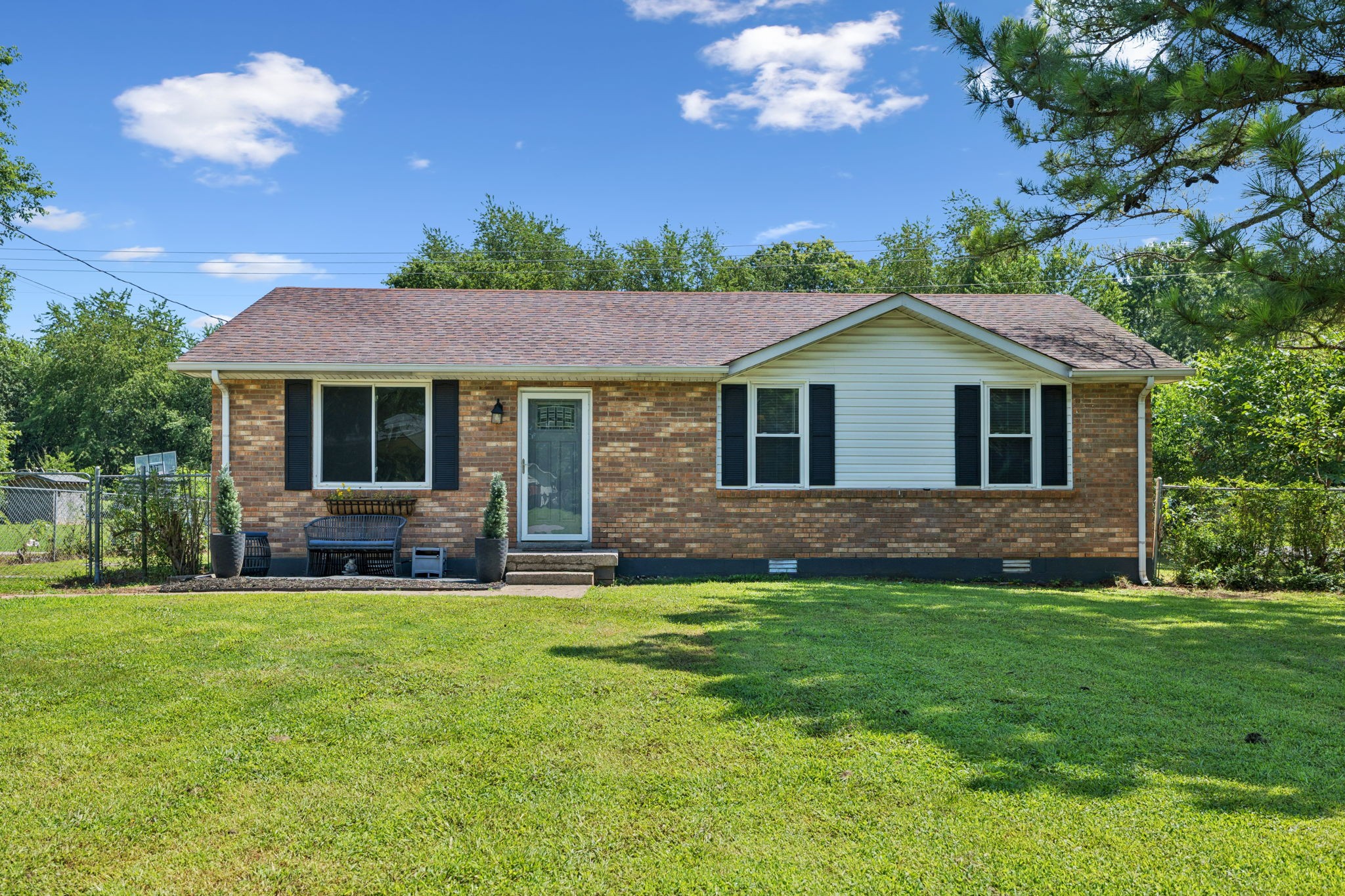 a front view of a house with a yard