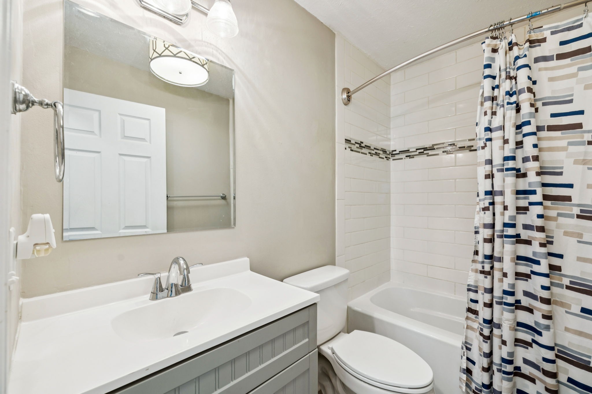 8124 Cooper Drive Murfreesboro, TN 37129 - Photo 11 of 19 a bathroom with a sink toilet a mirror and shower