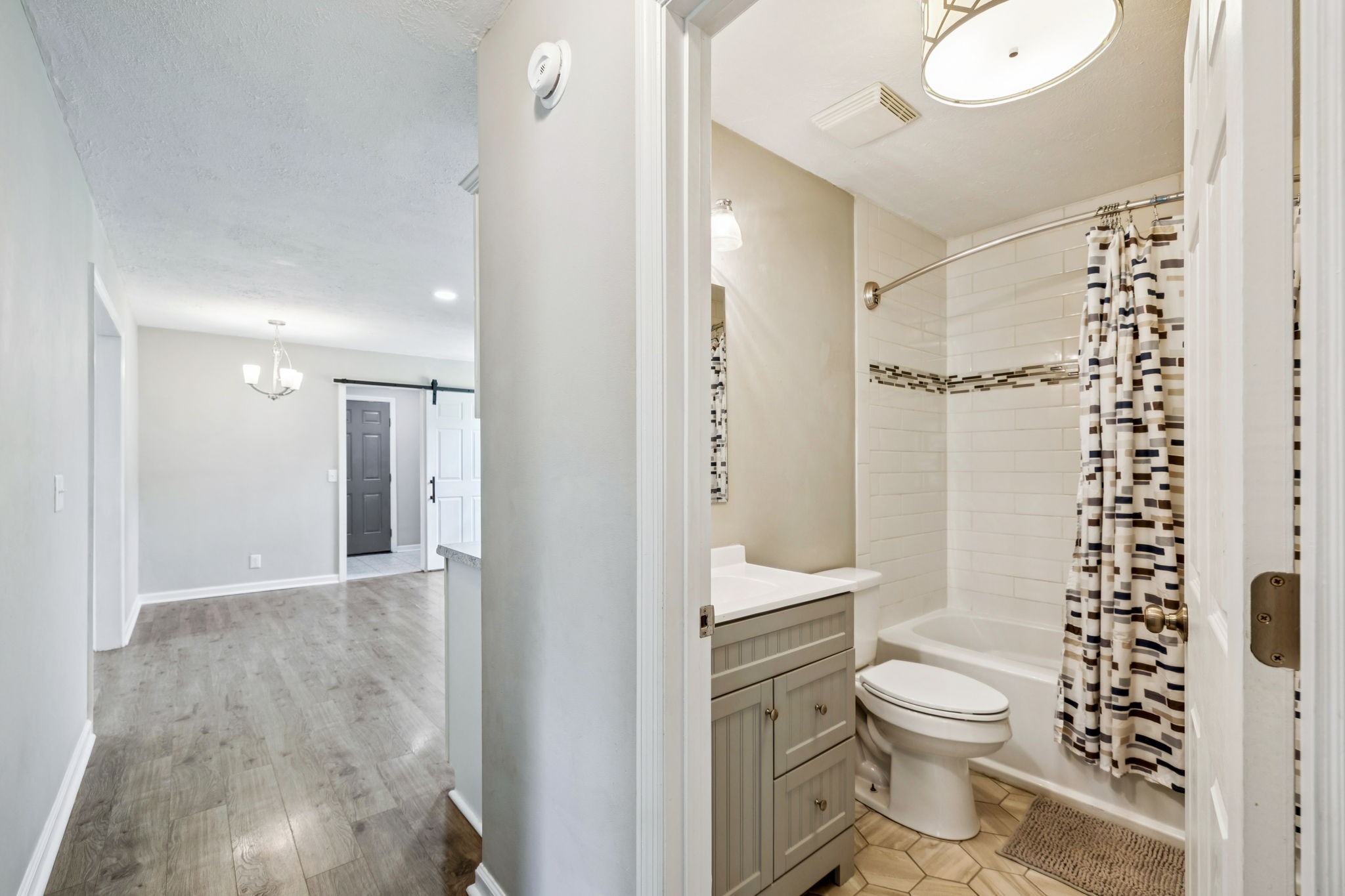 8124 Cooper Drive Murfreesboro, TN 37129 - Photo 16 of 19 a bathroom with a toilet a sink and a shower