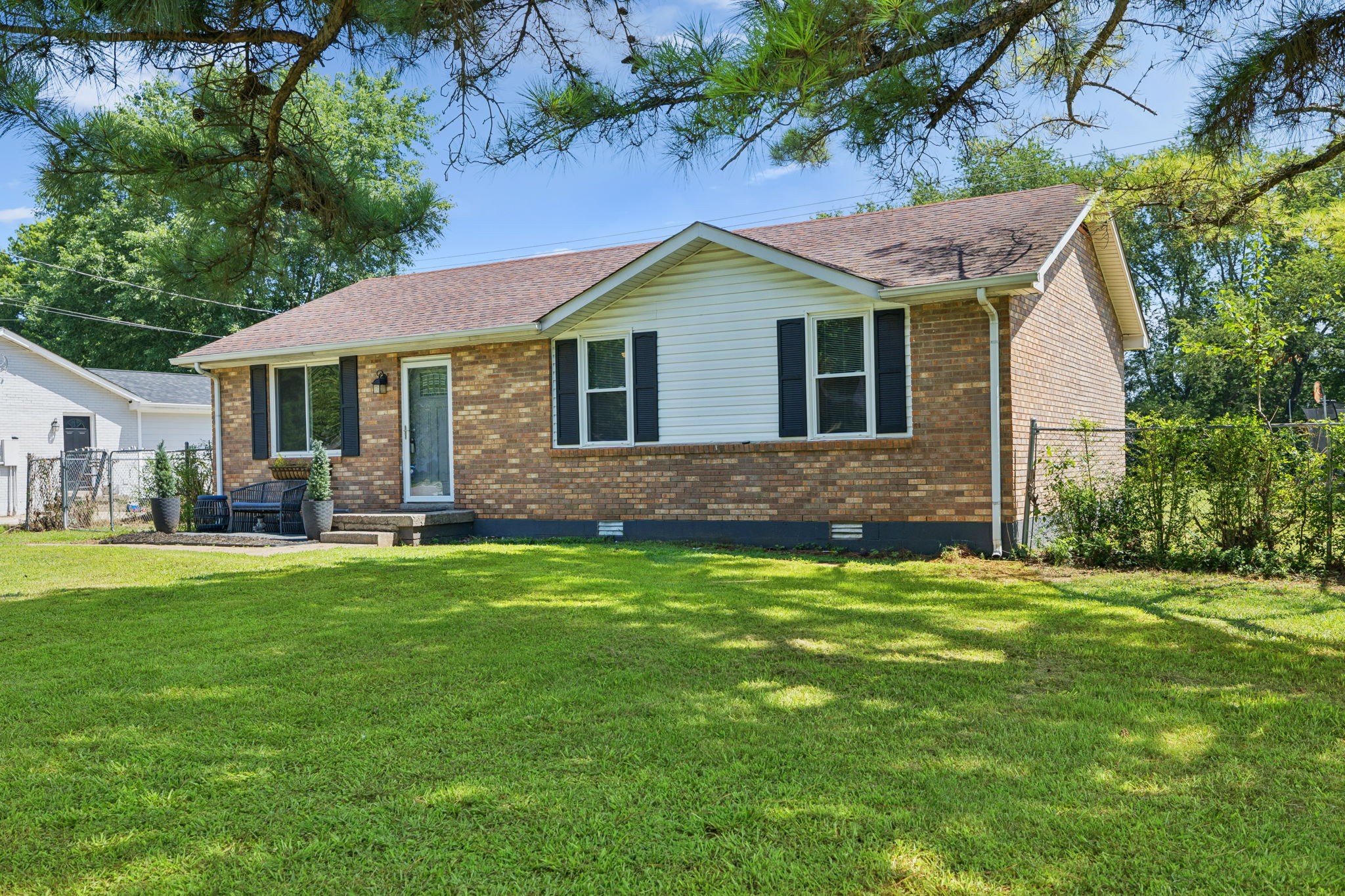 8124 Cooper Drive Murfreesboro, TN 37129 - Photo 2 of 19 a front view of a house with a garden