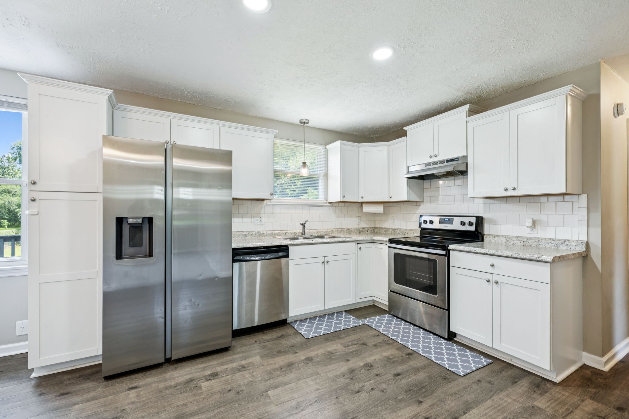 8124 Cooper Drive Murfreesboro, TN 37129 - Photo 8 of 19 a kitchen with cabinets stainless steel appliances and a window