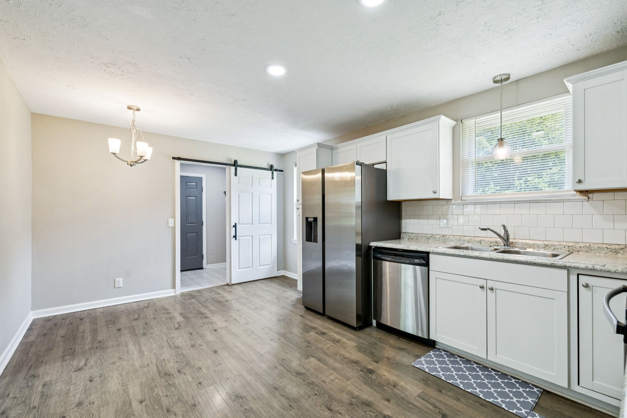 8124 Cooper Drive Murfreesboro, TN 37129 - Photo 9 of 19 a kitchen with stainless steel appliances granite countertop a refrigerator and a sink