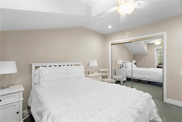 a large white bed in a white room