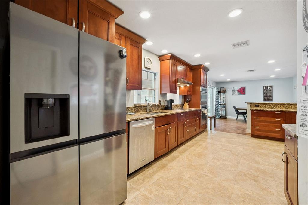 1050 Crystal Bowl Circle Casselberry, FL 32707 - Photo 11 of 64 a kitchen with stainless steel appliances refrigerator and microwave
