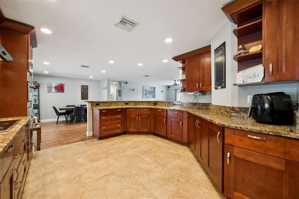 1050 Crystal Bowl Circle Casselberry, FL 32707 - Photo 12 of 64 a kitchen with stainless steel appliances granite countertop a sink and cabinets