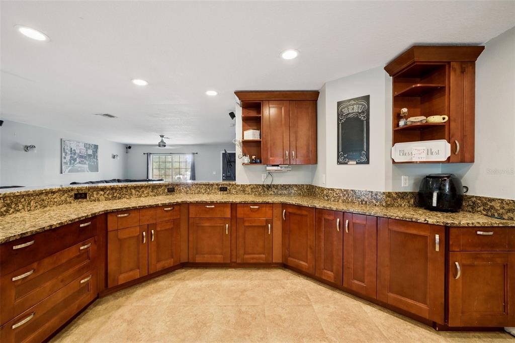 1050 Crystal Bowl Circle Casselberry, FL 32707 - Photo 13 of 64 a spacious bathroom with a granite countertop sink and a mirror