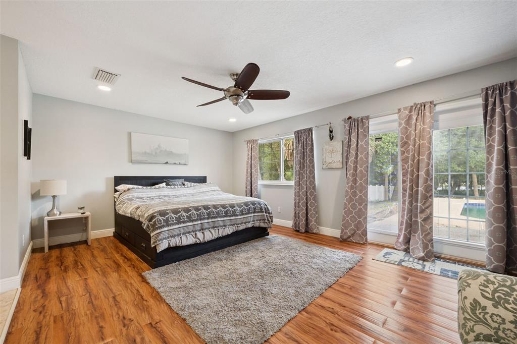 1050 Crystal Bowl Circle Casselberry, FL 32707 - Photo 18 of 64 a bedroom with a large bed and a window