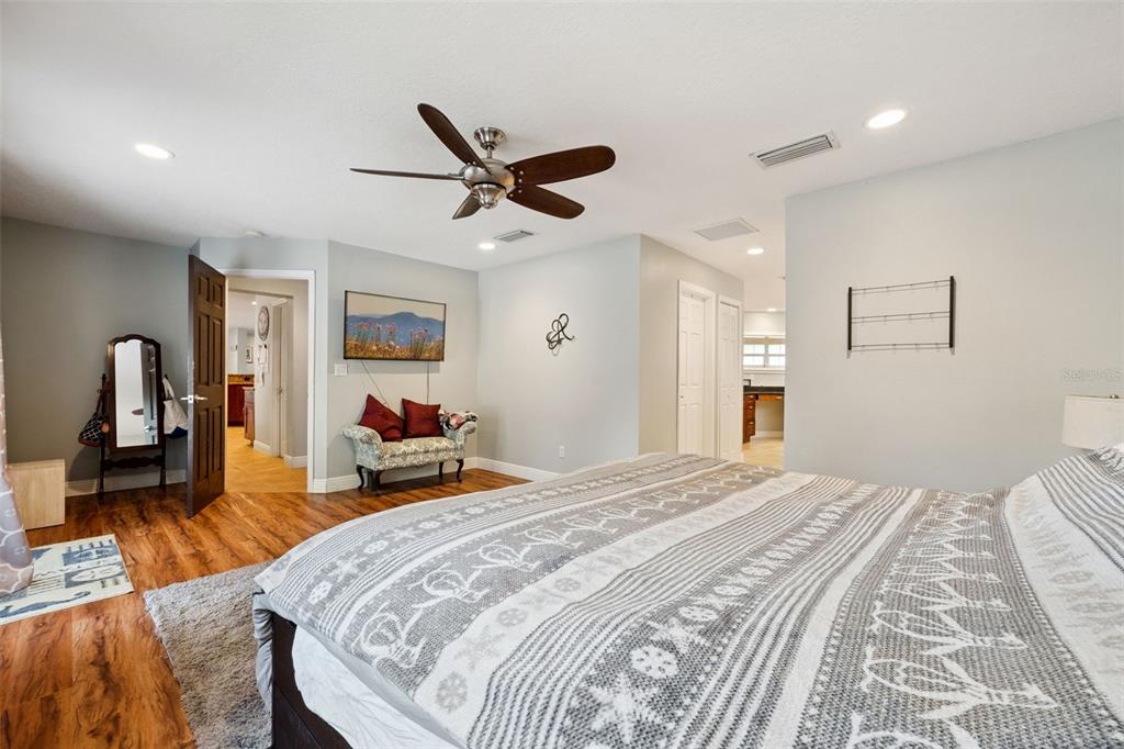 1050 Crystal Bowl Circle Casselberry, FL 32707 - Photo 19 of 64 a bedroom with a bed and a mirror