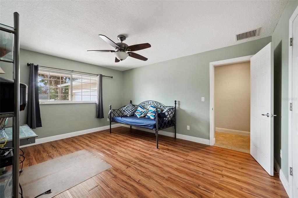 1050 Crystal Bowl Circle Casselberry, FL 32707 - Photo 24 of 64 a living room with furniture and a wooden floor
