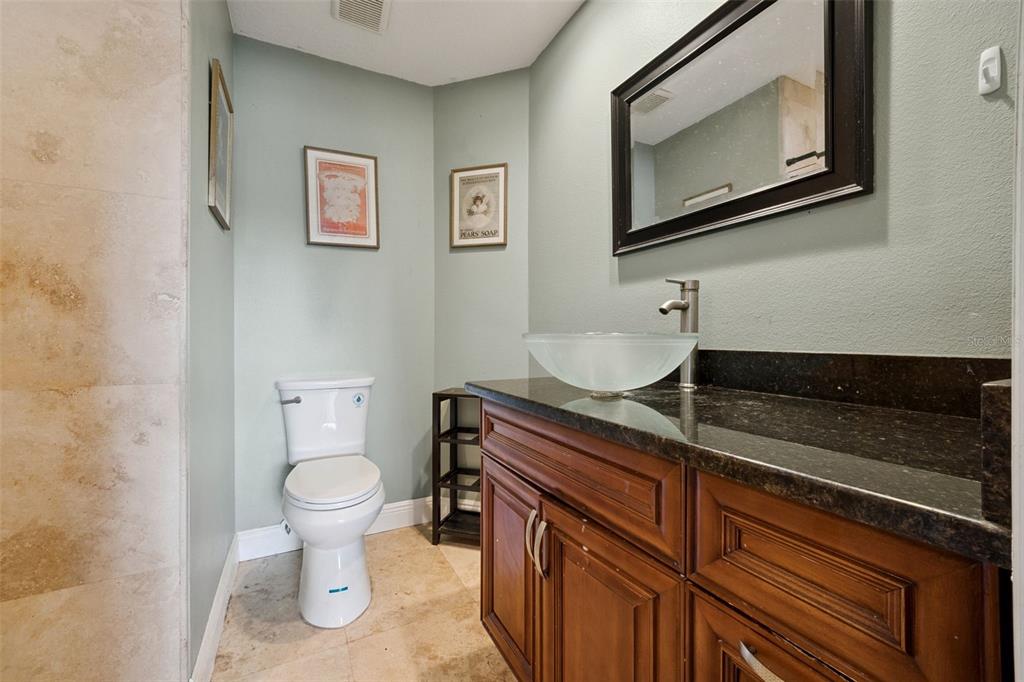 1050 Crystal Bowl Circle Casselberry, FL 32707 - Photo 26 of 64 a bathroom with a toilet a sink and mirror