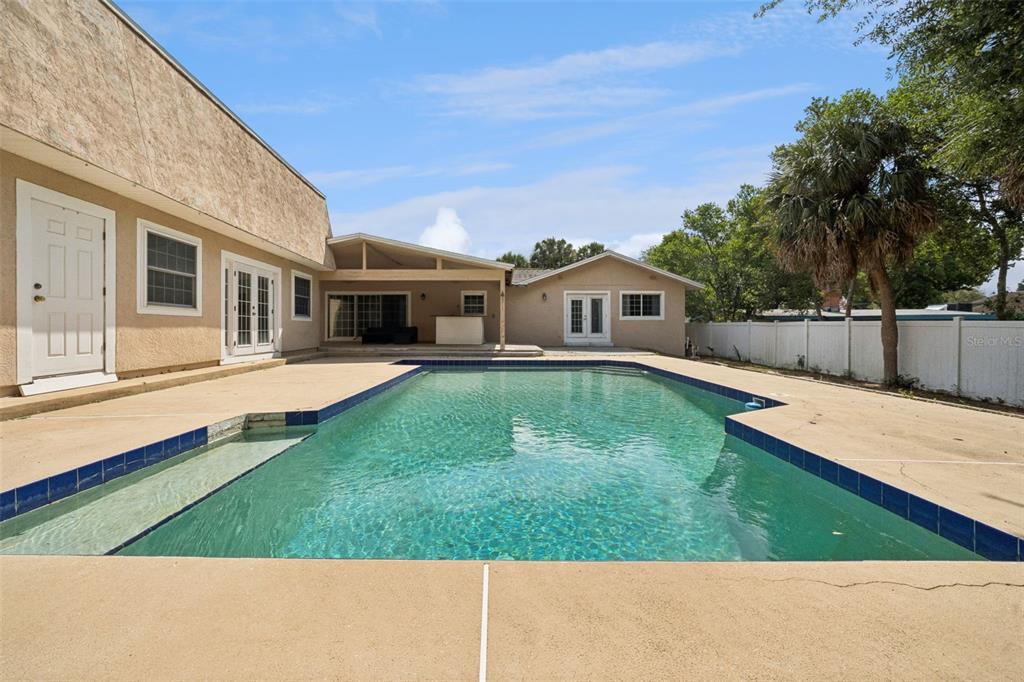 1050 Crystal Bowl Circle Casselberry, FL 32707 - Photo 31 of 64 a view of a house with a backyard and a patio