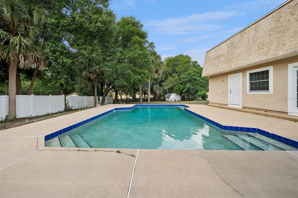 1050 Crystal Bowl Circle Casselberry, FL 32707 - Photo 33 of 64 a view of a backyard with swimming pool