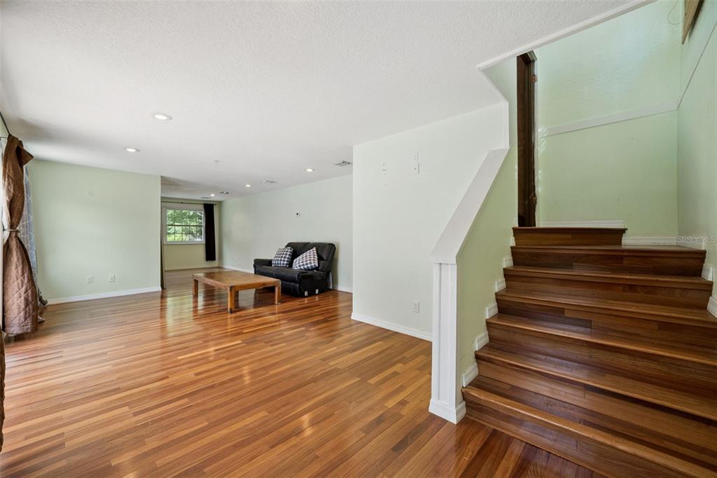1050 Crystal Bowl Circle Casselberry, FL 32707 - Photo 43 of 64 a view of a livingroom with wooden floor and furniture