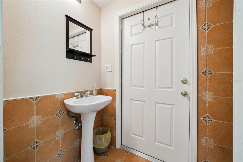 1050 Crystal Bowl Circle Casselberry, FL 32707 - Photo 47 of 64 a bathroom with a sink mirror and shower