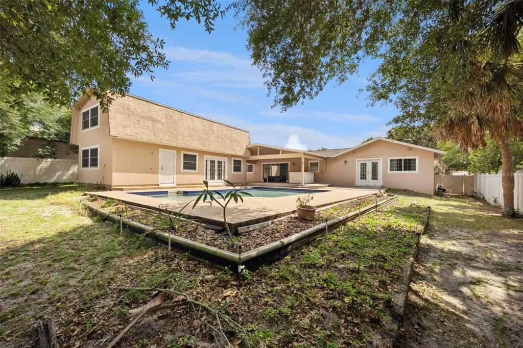 1050 Crystal Bowl Circle Casselberry, FL 32707 - Photo 49 of 64 a front view of a house with a yard table and chairs