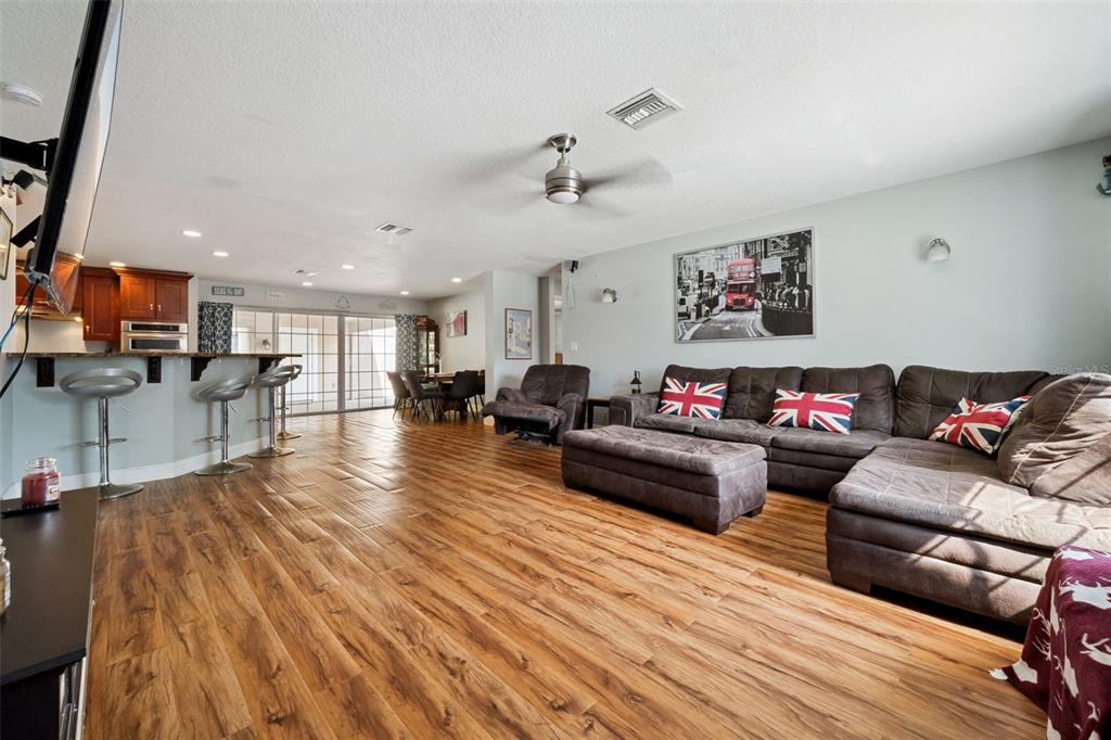 1050 Crystal Bowl Circle Casselberry, FL 32707 - Photo 5 of 64 a living room with furniture and a flat screen tv