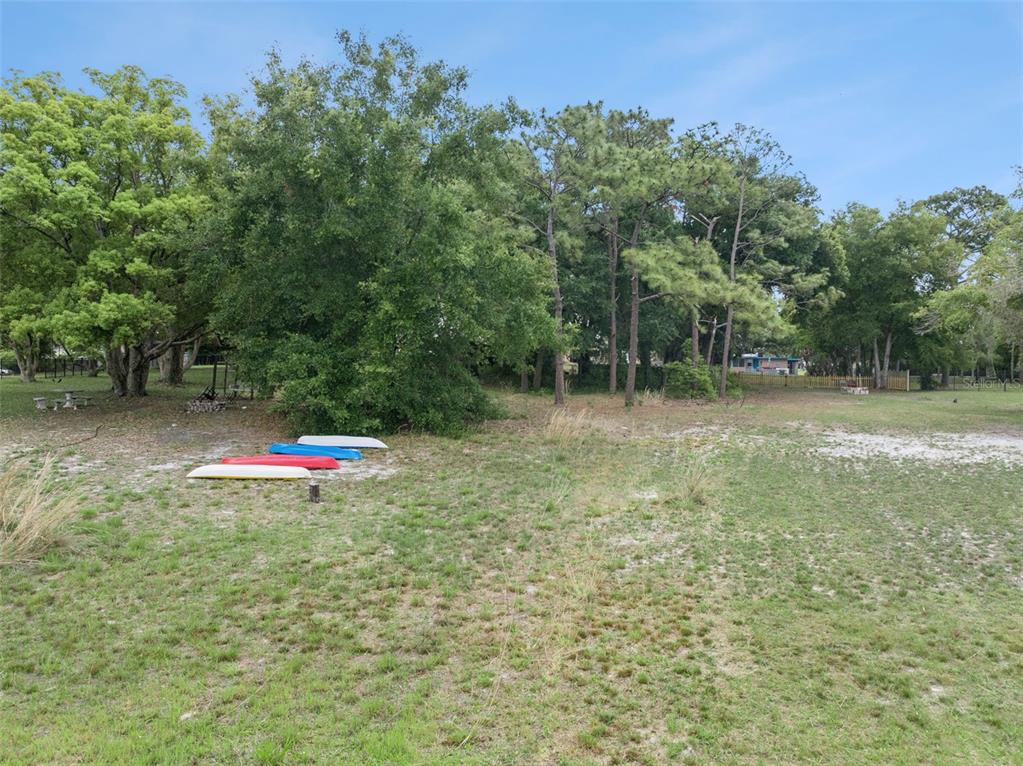 1050 Crystal Bowl Circle Casselberry, FL 32707 - Photo 53 of 64 a view of a field with trees in the background
