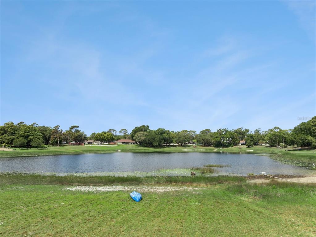 1050 Crystal Bowl Circle Casselberry, FL 32707 - Photo 54 of 64 a view of a lake with houses in the background