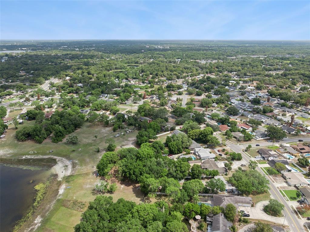 1050 Crystal Bowl Circle Casselberry, FL 32707 - Photo 58 of 64 an aerial view of residential houses with outdoor space and trees
