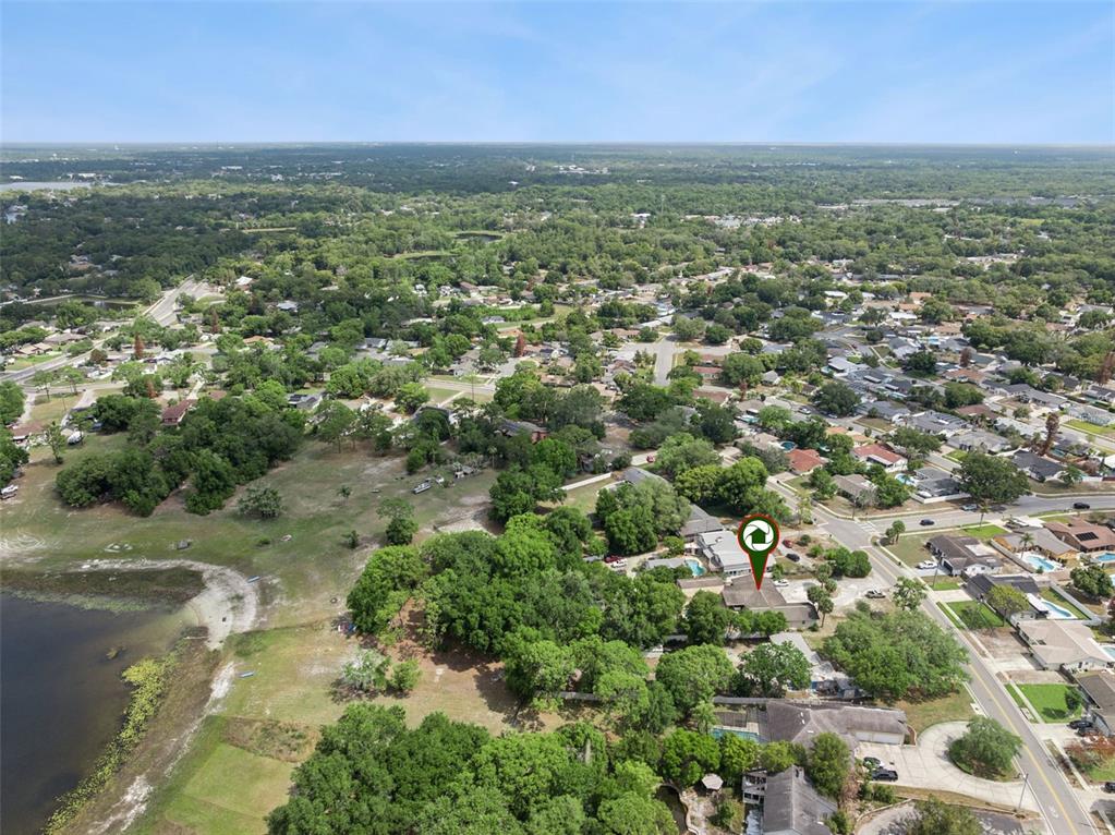 1050 Crystal Bowl Circle Casselberry, FL 32707 - Photo 59 of 64 an aerial view of residential houses with outdoor space and trees