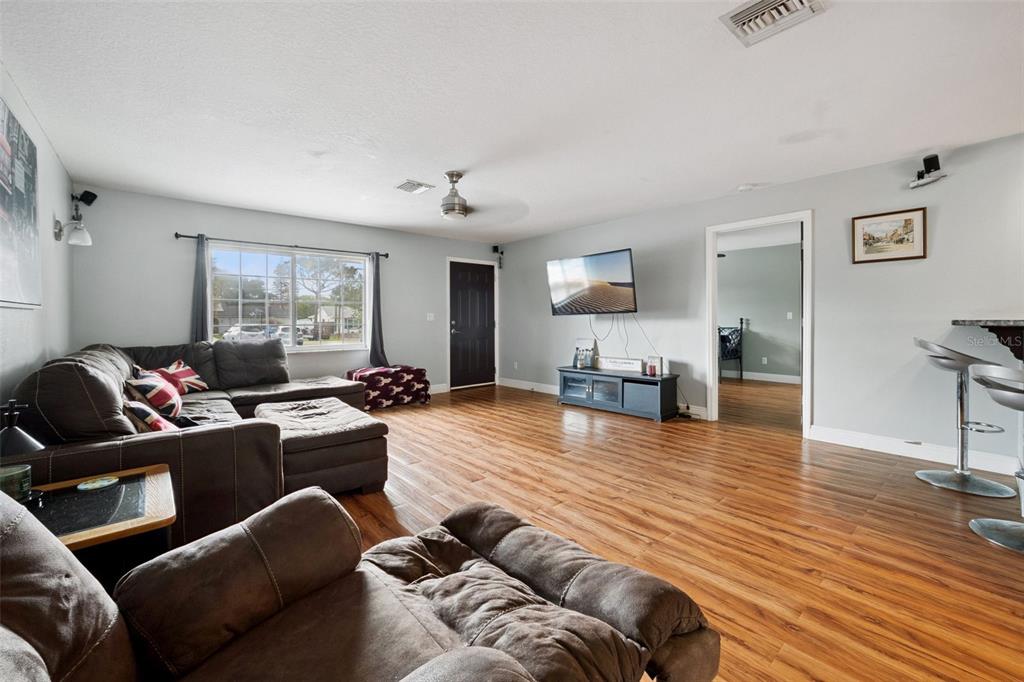 1050 Crystal Bowl Circle Casselberry, FL 32707 - Photo 6 of 64 a living room with furniture and a wooden floor
