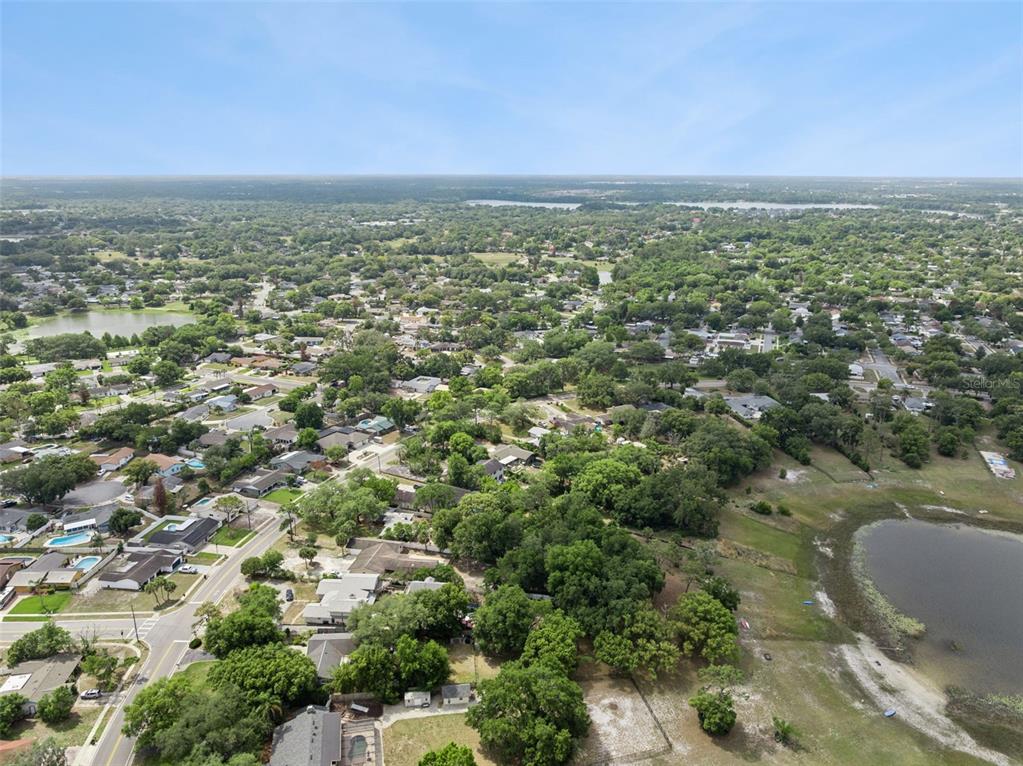 1050 Crystal Bowl Circle Casselberry, FL 32707 - Photo 63 of 64 an aerial view of residential houses with outdoor space