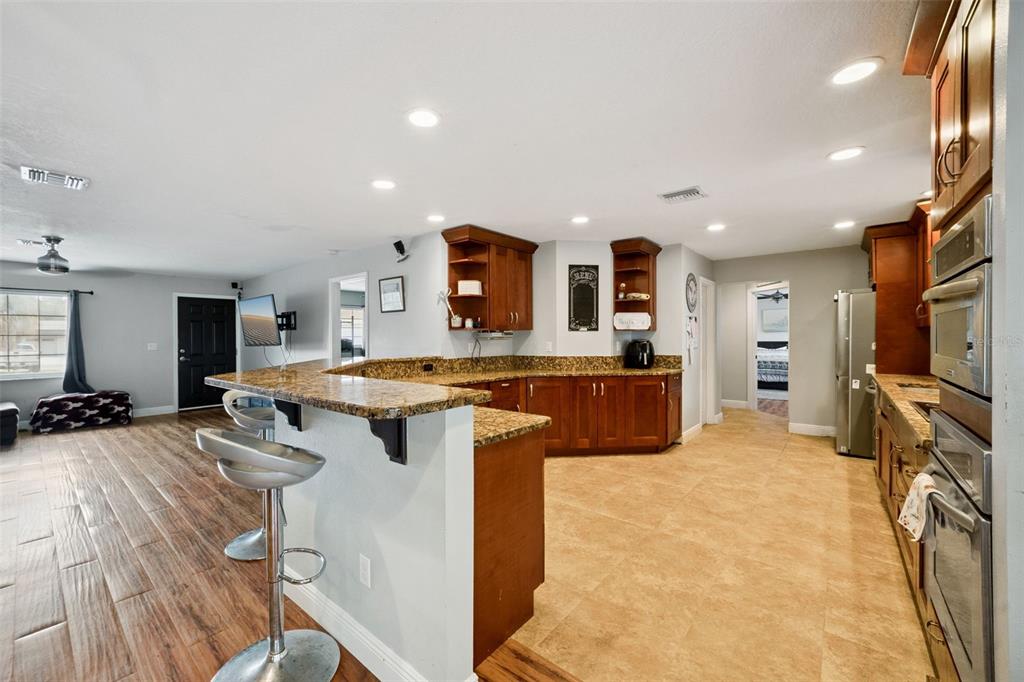 1050 Crystal Bowl Circle Casselberry, FL 32707 - Photo 10 of 64 a large kitchen with a large counter top appliances and cabinets