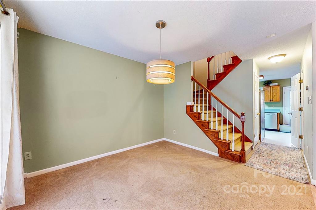 254 Bubbling Well Road Denver, NC 28037 - Photo 22 of 38 a view of entryway with stairs and wooden floor